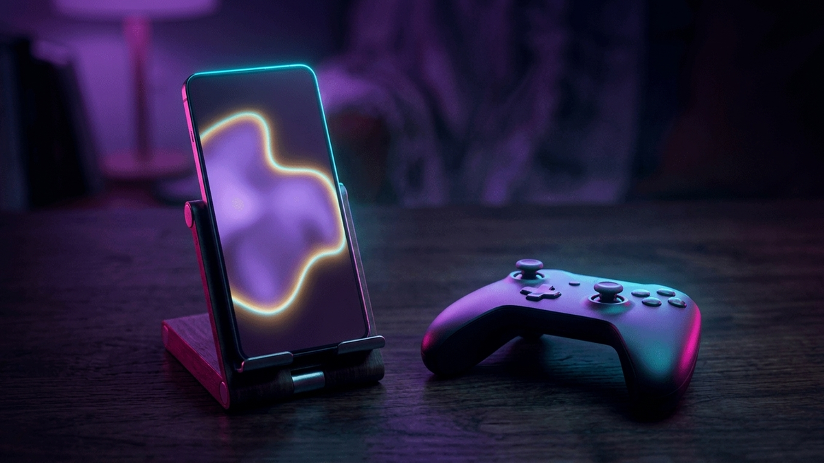 Illustration: ein Smartphone in einem kleinen Ständer auf einem dunklen Tisch, daneben ein klassisches kabelloses Gamepad